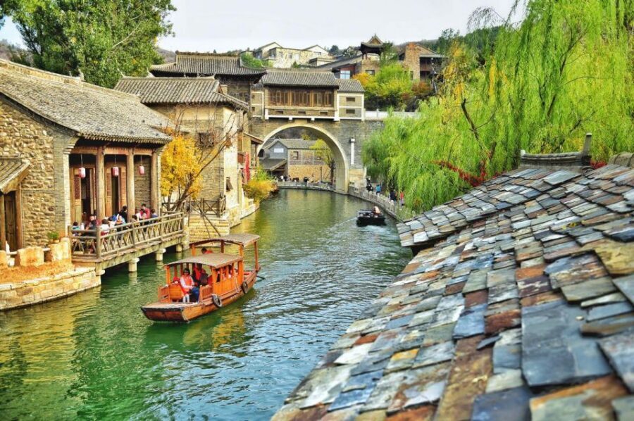 Beijing: Jinshanling and Simatai Wall&Gubei Watertown Tour - Gubei Water Town at dusk: canals, shops, and a southern-China feel in the north