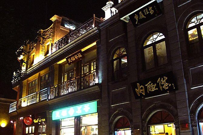 Beijing Private Night Walking Tour: Qianmen Street, Tian'ammen Square and Wangfujing Street - Qianmen Street at night: old lanes, famous brands, and snack-friendly energy