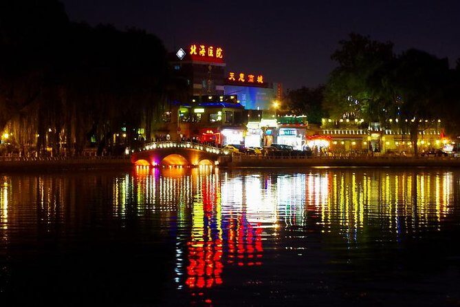Private Night Tour: Discover Beijing in Bustling Lights - Olympic Park at night: the Bird’s Nest and Water Cube glow